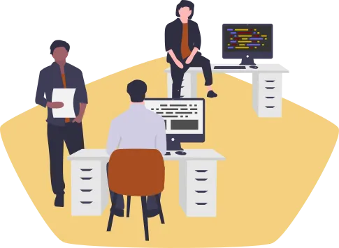 Three software developers working at their desks